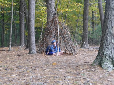the boys in a stick house in the woods
