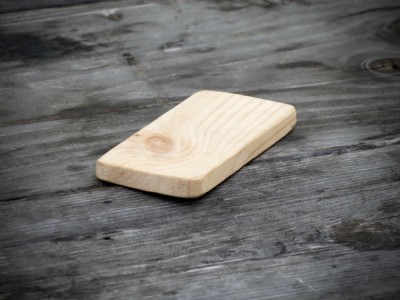 a wooden phone on the picnic table