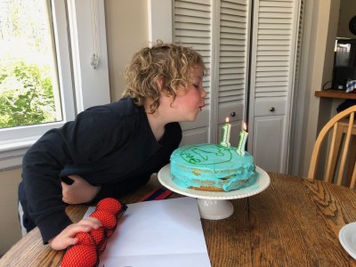 Zion blowing out birthday candles at his grandparents' house