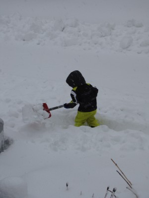 Zion shoveling in deep snow