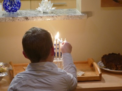 Zion lighting the Hannukah candles